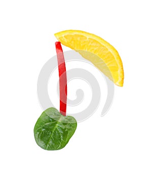 Musical note made of fruits and vegetables on white background