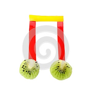 Musical note made of fruits and vegetables on white background, top view