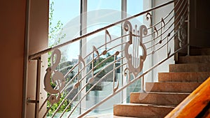 Musical notes cascading down a staircase. Staircase adorned with whimsical music notes