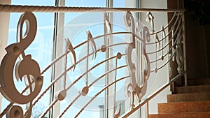 Musical notes cascading down a staircase. Staircase adorned with whimsical music notes