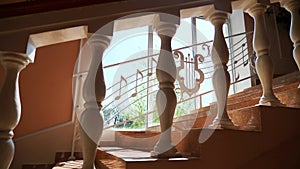 Musical notes cascading down a staircase. Staircase adorned with whimsical music notes