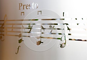 Musical notes on frosted glass, art background