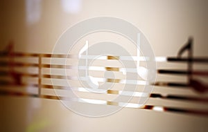 Musical notes on frosted glass, art background