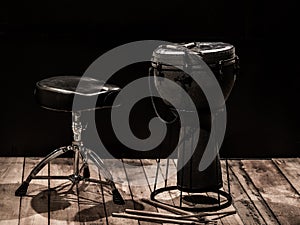 musical percussion instruments on black background