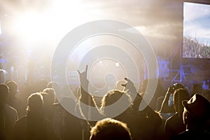 Musical Rock Concert. Silhouettes of a concert crowd of people fans shows a goat
