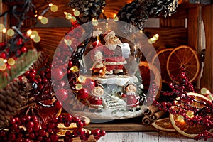 Musical Snow Globe with Santa Claus on bokeh background