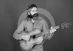 musical string instrument. mature charismatic male guitarist. guy with beard and moustache play guitar. bearded man in
