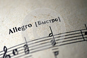 Musical tempo `Allegro` in a music notebook