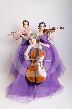 Musical trio in evening gowns