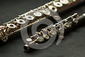 Musical wind instrument piccolo flute and brass flute. photo