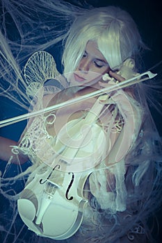 Musician, Beautiful violinist trapped in a spider web
