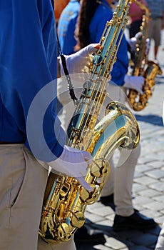 musician of a brass band with saxophone