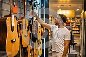 Musician buying guitar in store