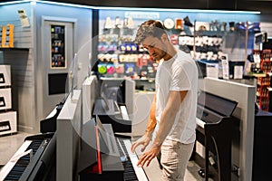 Musician choosing instruments in store