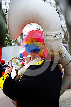 Musician clown playing tuba photo