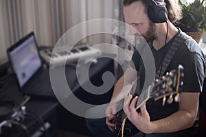 Musician composing music at home
