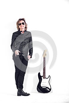 Musician dressed in black leather on white background