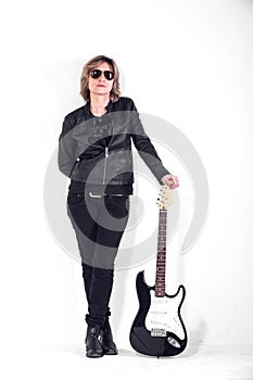 Musician dressed in black leather on white background