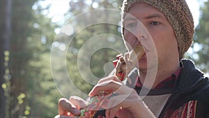 Musician in ethnical costume plays on the peruvian flute