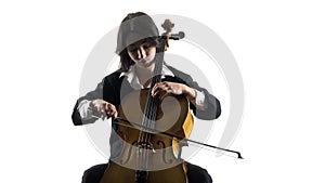 Musician girl plays a violoncello rehearsing a composition. White background