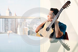 Musician With Guitar Feeling Uninspired And Lacking Creativity photo