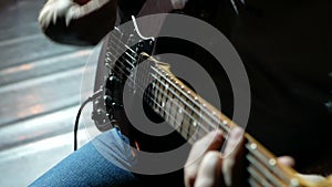 Musician , guitarist playing electric guitar. Close up.