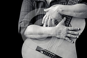 Musician hand sholding a classic guitar