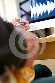 Musician hands paying electric guitar