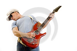 Musician holding and playing an electric guitar