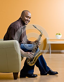 Musician holding saxophone