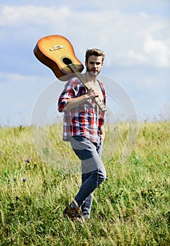 Musician looking for inspiration. Wanderlust concept. Inspiring nature. Guy with guitar contemplate nature. In search of