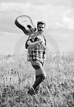 Musician looking for inspiration. Wanderlust concept. Inspiring nature. Guy with guitar contemplate nature. In search of photo