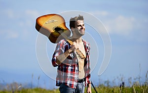 Musician looking for inspiration. Wanderlust concept. Inspiring nature. Summer vacation. Dreamy wanderer. Peaceful mood