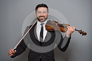 Musician man playing the violin. Musical instrument on performer