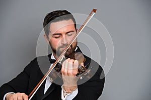 Musician man playing the violin. Musical instrument on performer