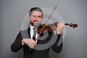 Musician man playing the violin. Musical instrument on performer