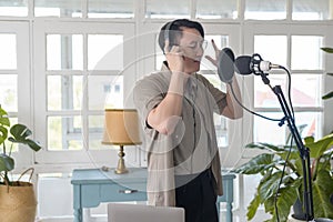 Musician man  is recording new song in home Studio