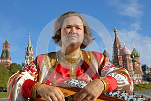 Musician with music instrument gusli