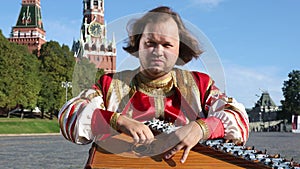 Musician with music instrument gusli