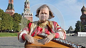 Musician with music instrument gusli, Russia