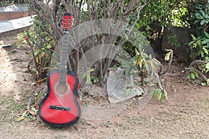 The musician places his red Fender Squier Stratocaster-A beautiful strap for a guitar made of genuine leather