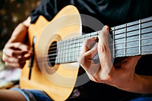 Musician playing acoustic guitar