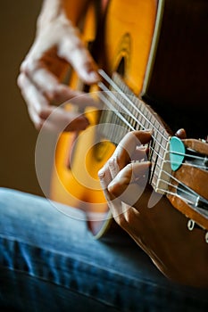 Musician playing acoustic guitar