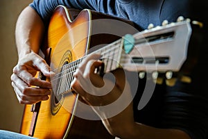 Musician playing acoustic guitar