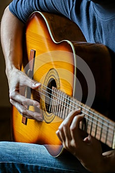 Musician playing acoustic guitar