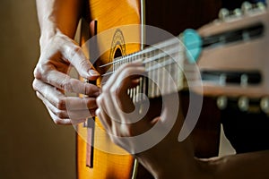 Musician playing acoustic guitar