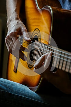 Musician playing acoustic guitar