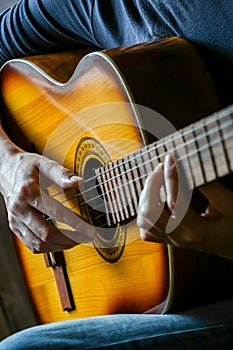 Musician playing acoustic guitar