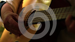 Musician playing acoustic guitar