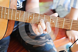 Musician playing acoustic guitar